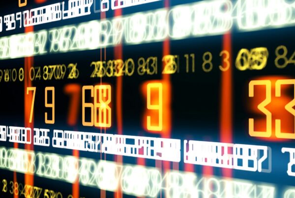 Vibrant looping video digital display of streaming numbers in orange, yellow, and white on a dark background, showcasing dynamic data visualization and technological themes.