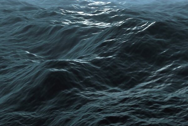 A serene ocean video loop with rolling blue waves glistening under sunlight, highlighting the natural beauty and dynamic surface texture.