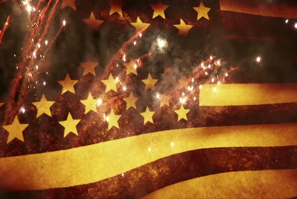 A dramatic video loop blend of the American flag and fireworks, symbolizing patriotic celebration.