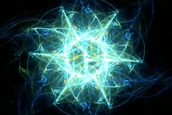 A glowing fractal starburst 4K animation loop in blue and green hues against a black background, showcasing intricate and radiant designs.