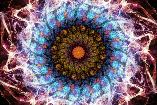 A vibrant and intricate fractal mandala 4K video loop with colorful geometric symmetry and radiant energy.