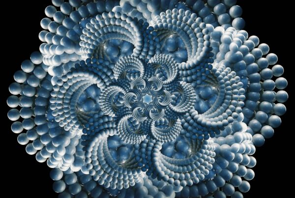 Looping video animation of an intricate fractal design featuring blue and white spheres arranged in a mesmerizing pattern against a black background.