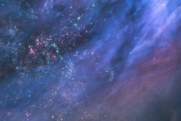 A breathtaking video loop journey through a star-filled cosmos, featuring a blue-tinted expanse with brilliant stars and interstellar clouds creating an ethereal display, embodying the vast beauty of the universe.