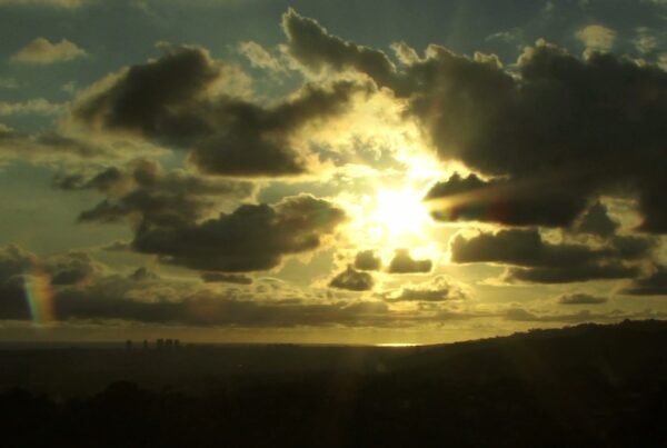 The video features a striking view of a time-lapse sky during sunset.