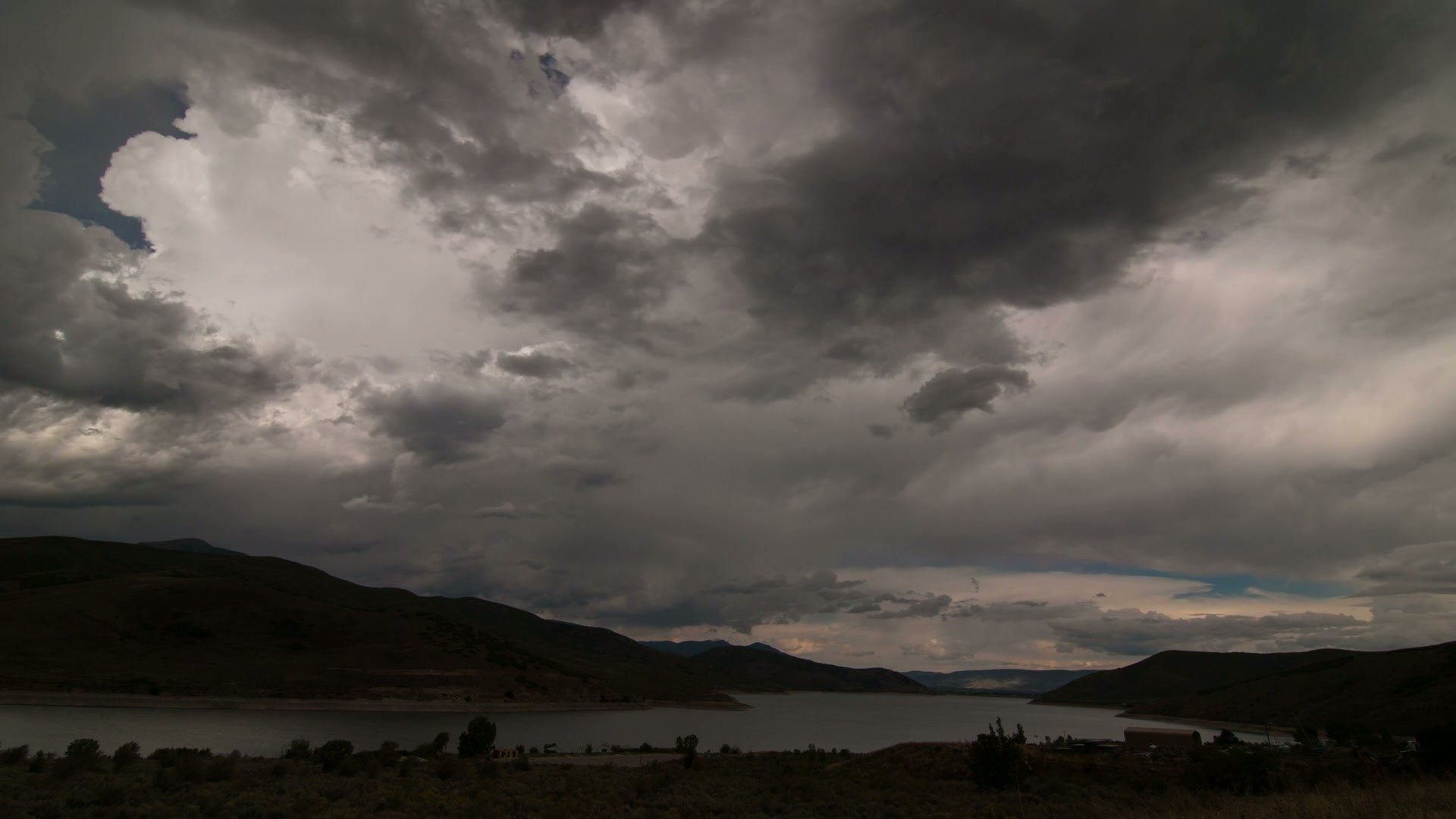 Time-Lapse Storm Clouds Over Tranquil Lake