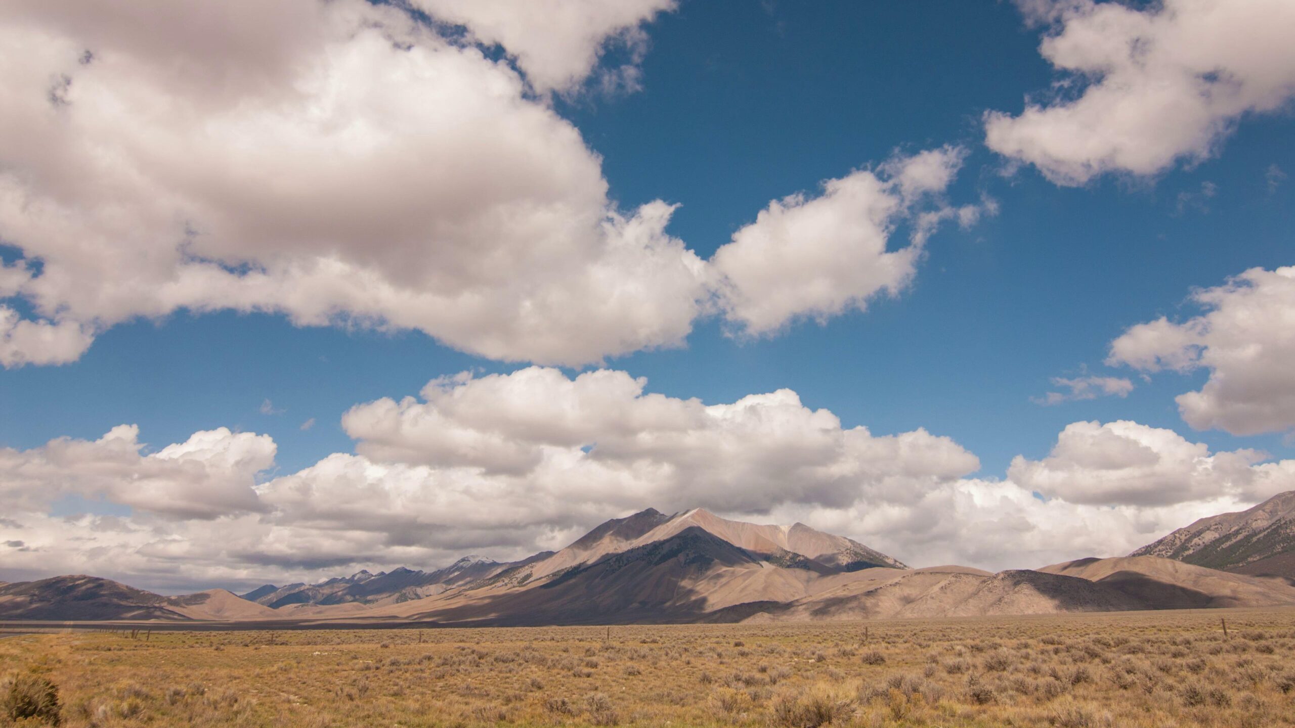 Mountain Majesty Under Blue Time-Lapse Sky