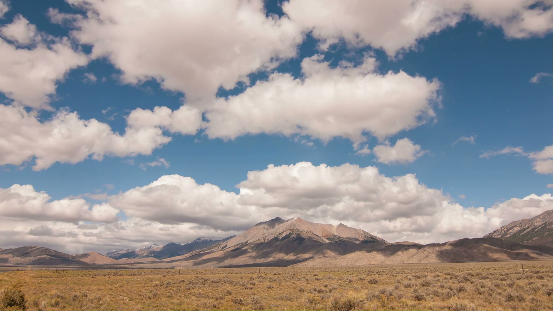 Majestic Mountains Under Vast Time-Lapse Sky