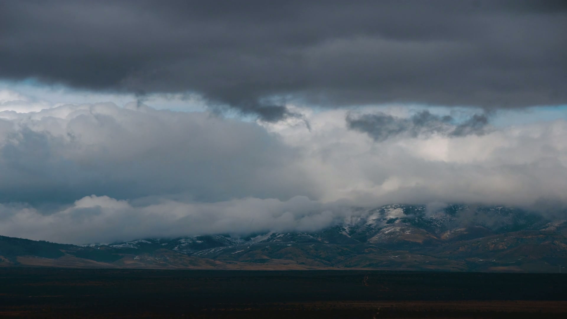 Stormy Mountains Under Dark Time-Lapse Clouds