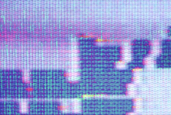 A vibrant pixelated abstract art video loop that resembles device screen pixels in macro, with blue, purple, and pink colors, showcasing a modern, digital style.