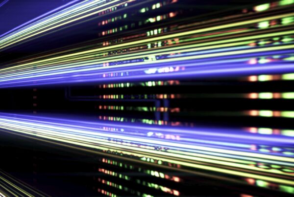 Abstract 4K video loop of digital light patterns, featuring contrasting shades of orange and blue.