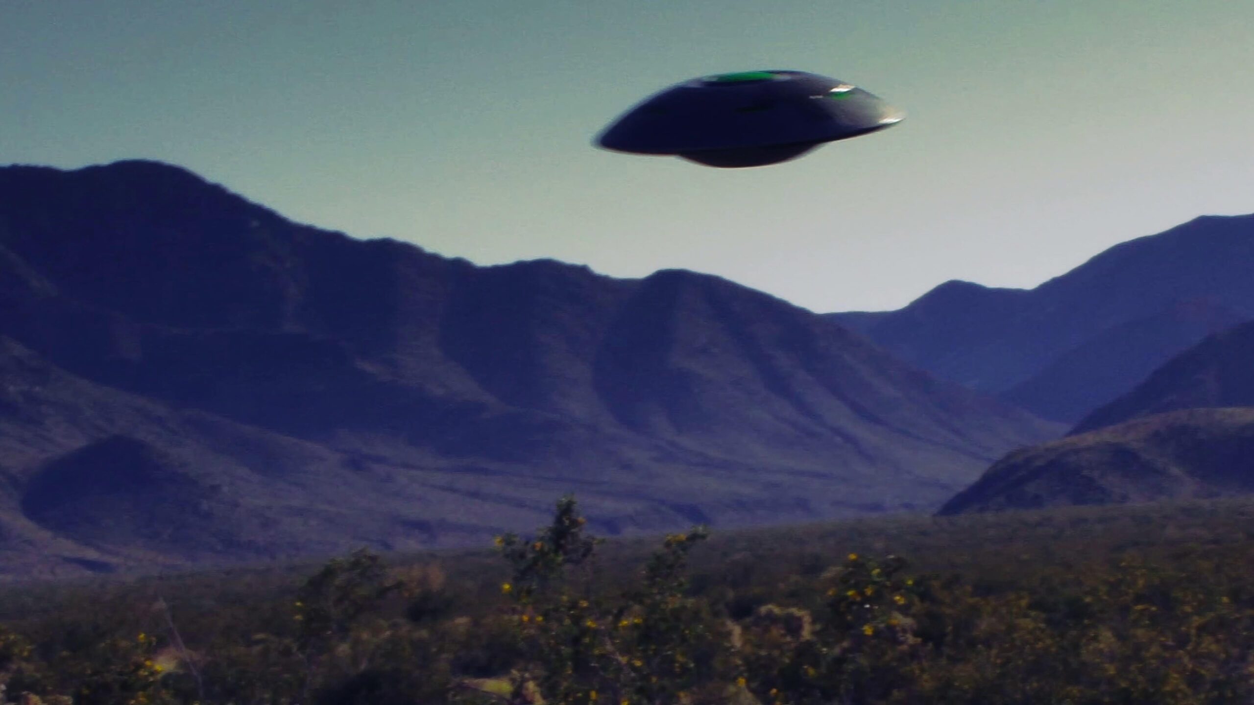 Alien UFO Hovering Over Mountains 4K Video