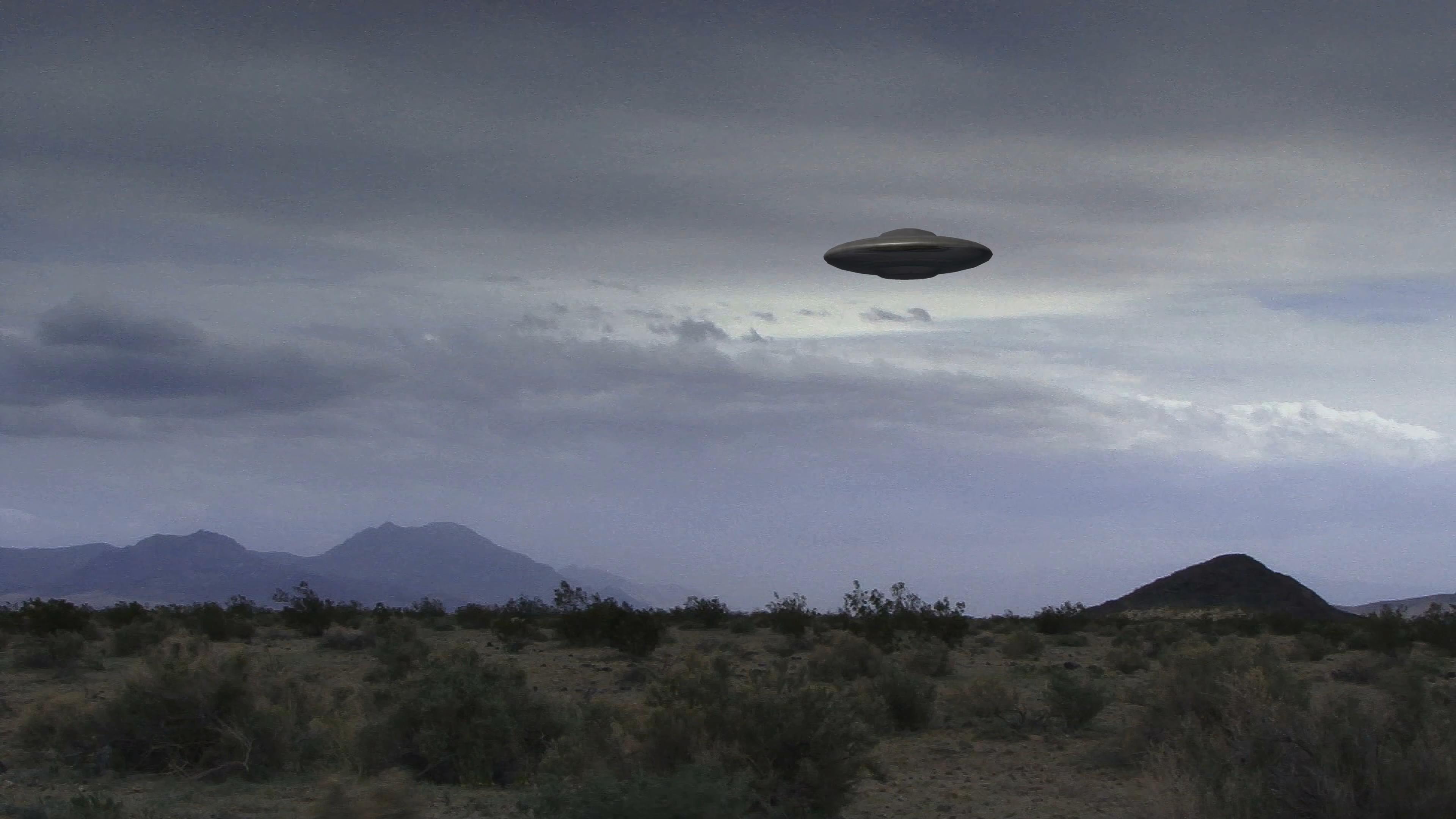 UFO Hovering Over Desert Landscape 4K Video