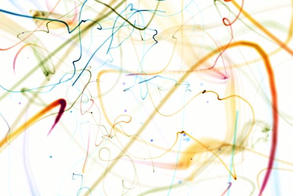 Abstract animation loop featuring vibrant swirling colors and lines on a white background, creating a dynamic and lively composition.