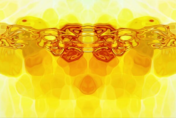 Vibrant symmetrical abstract art video loop with dynamic yellow and orange fluid patterns, creating a mirrored effect and intricate design.