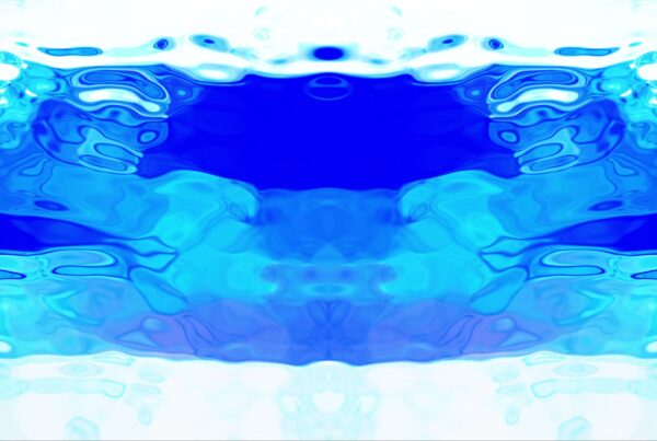 Abstract video loop featuring vibrant shades of blue and white, creating a symmetrical, fluid pattern reminiscent of waves or liquid, evoking a calming oceanic atmosphere.