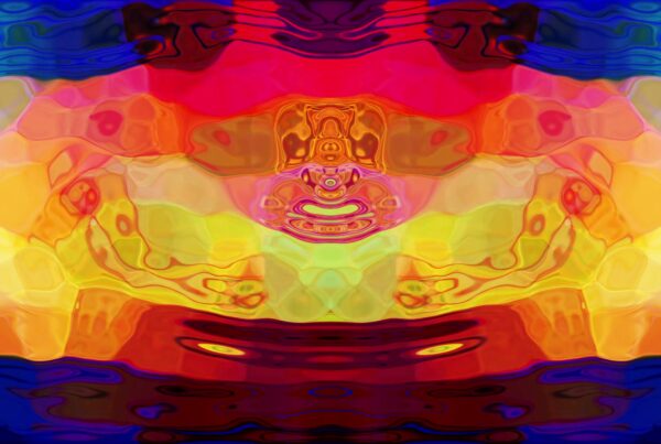 Colorful video loop of abstract symmetrical waves and ripples with vibrant red, yellow, and blue hues creating a dynamic and fluid digital animation reminiscent of psychedelic art.
