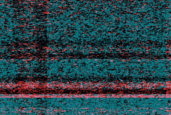 An abstract video loop of glitch art featuring a vibrant pixelated texture with cyan and red colors, evoking dynamic digital static and disruption.