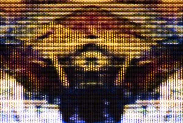 An abstract looping video of a digital pattern featuring vibrant gold and reddish-brown hues with a pixelated, symmetrical design, creating a futuristic and technological aesthetic.