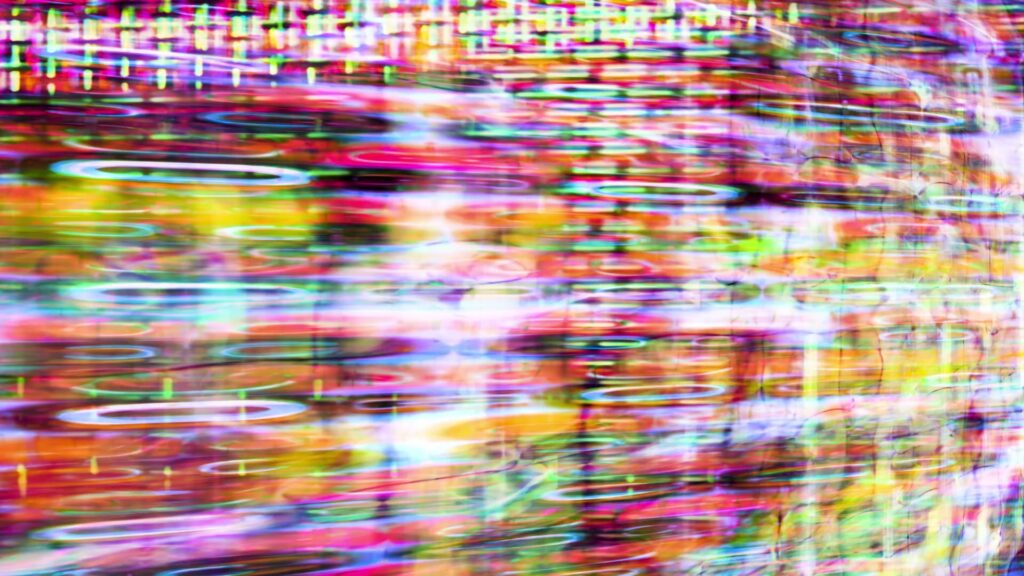 Vibrant abstract digital video loop featuring bright pink, blue, and yellow colors with fluid lines and glowing patterns, resembling a futuristic data visualization.