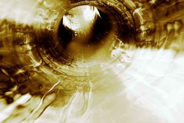 This 3D animation loop depicts an abstract scene that resembles looking down a tunnel or vortex.