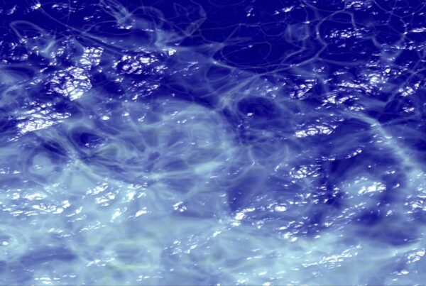Abstract video loop of blue and white swirling liquid patterns creating a mesmerizing, fluid texture with dynamic light and shadow interplay.