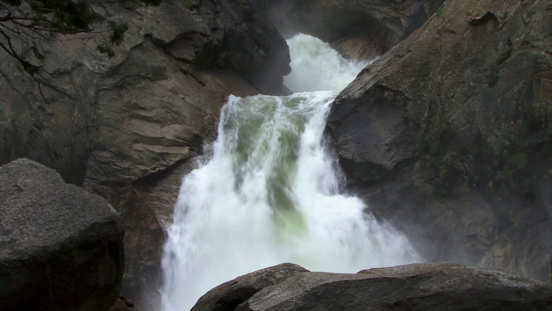 Majestic Waterfall Amidst Rugged Rocks Loop