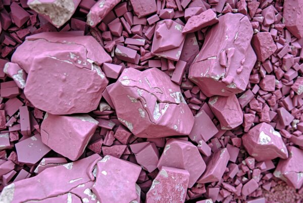 Pink geometric stones with cracks.