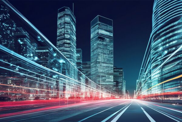 Futuristic cityscape with illuminated skyscrapers at night showing light trails and modern architecture.