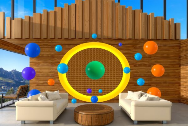 A modern living room with sofas, colorful orbs, and scenic mountain view.