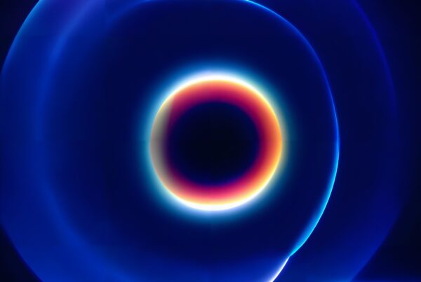 Abstract design with glowing, vibrant circular patterns in rich blues and purples.