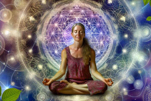 A person meditates amidst cosmic geometric designs, symbolizing spiritual enlightenment and deep connection to nature.