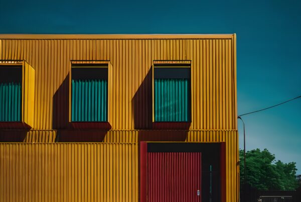 Vibrant yellow building with cyclist.