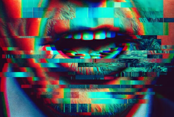 Abstract close-up of a mouth with glitch effects and vibrant colors.