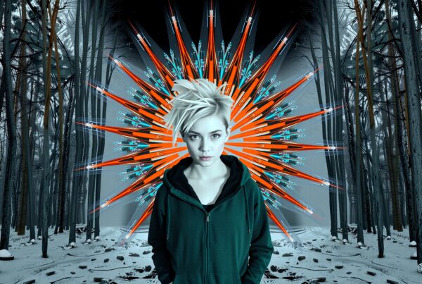 A person in hoodie stands in a snowy forest with geometric art.