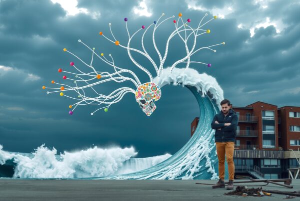 Surreal scene of wave with colorful skull, neural tendrils, man, and buildings.