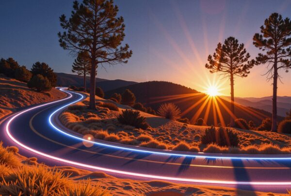 A winding neon-lit road through a sunset landscape with silhouetted trees.