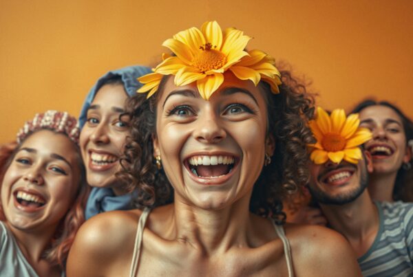 A group of friends joyfully laughing, surrounded by vibrant colors and flowers, showcasing happiness and camaraderie.
