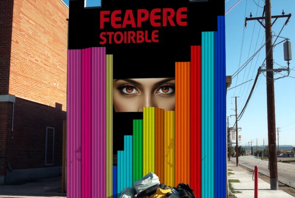 Colorful urban mural with eyes on building wall.