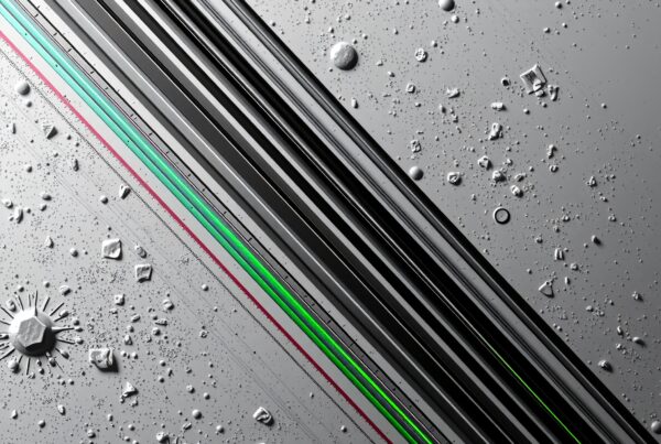 Futuristic geometric image with sleek black lines on metallic grey.