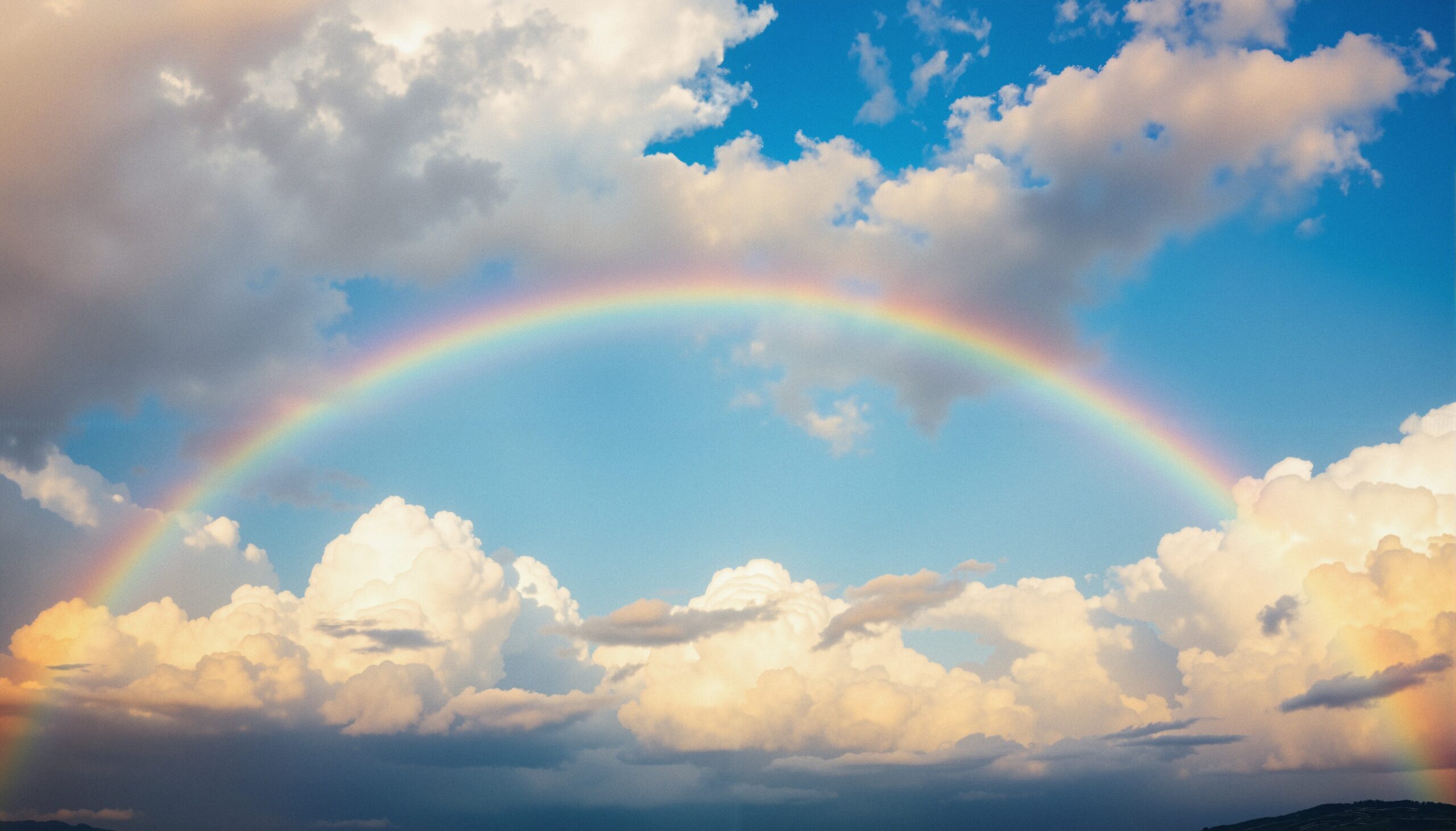 Rainbow Across Bright Blue Sky