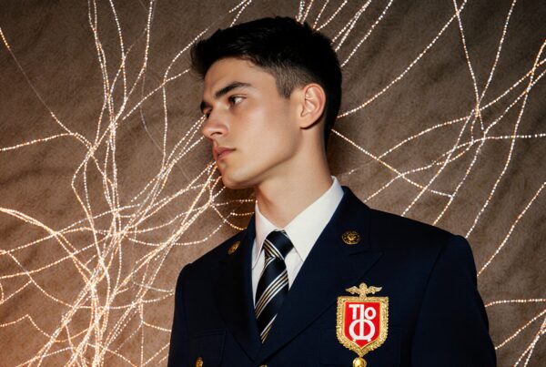 Portrait of a man in uniform with illuminated background.