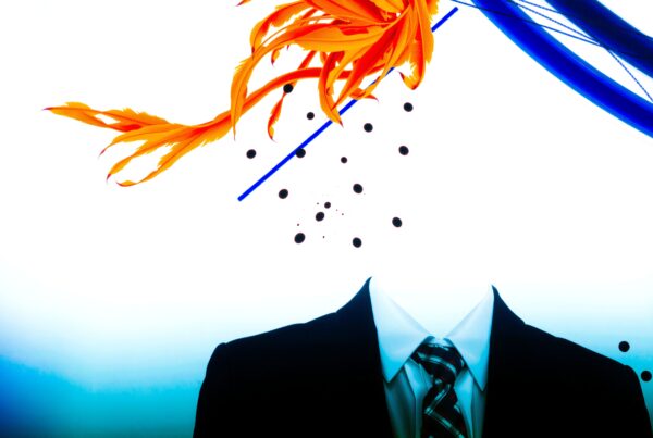 A surreal image of a black suit with a vibrant explosion of orange feathers and blue elements on a white background, blending formal and natural elements artistically.