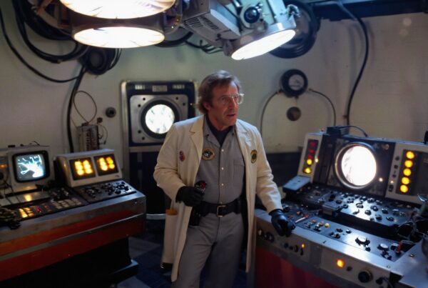 A scientist in a retro laboratory works with vintage control panels, enveloped in a warm, illuminated ambiance suitable for scientific exploration.