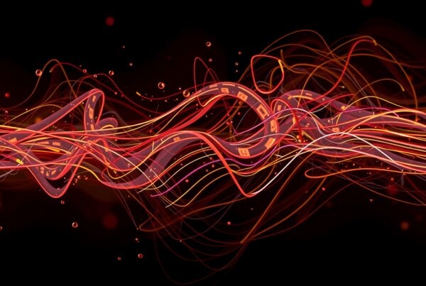 Abstract digital artwork of intertwining red, orange, and yellow light trails on a dark background with scattered glowing particles.