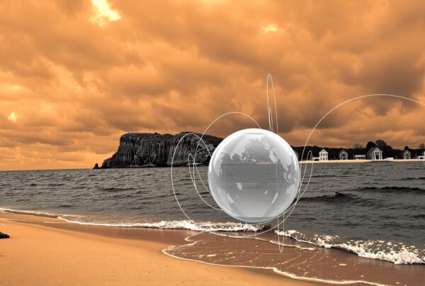 A futuristic beach scene with digital spheres under an orange sky.