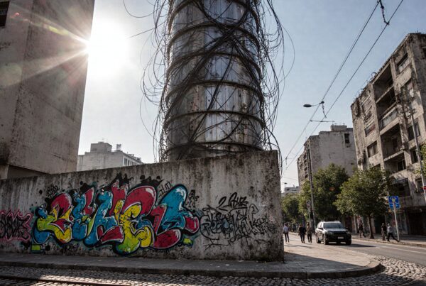 Urban scene with graffiti-covered walls.