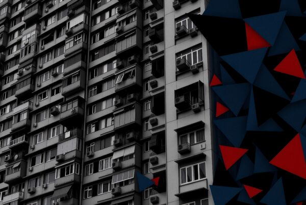 High-rise building with abstract geometric art.