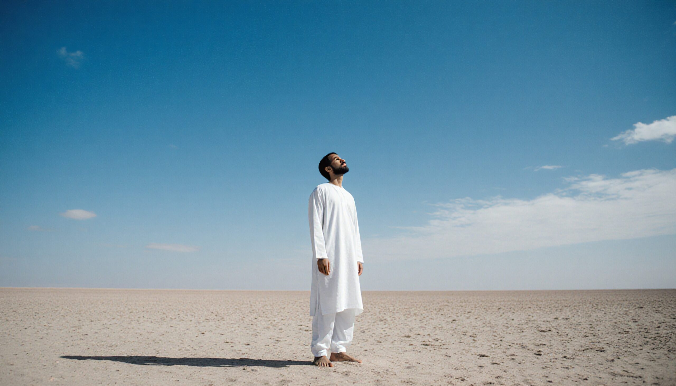 Man gazing in open desert