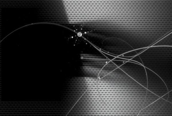 Monochrome abstract image with intersecting lines and circular central element.