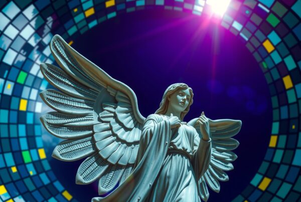 Statue of an angel with wings in front of a colorful mosaic tile background, illuminated by a dramatic light.